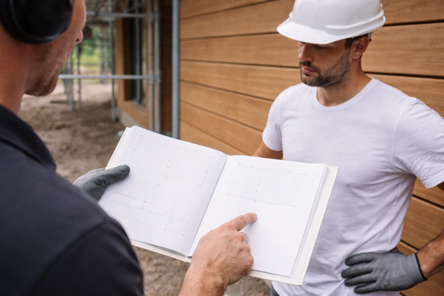 two men discussing installation of avara timber cladding